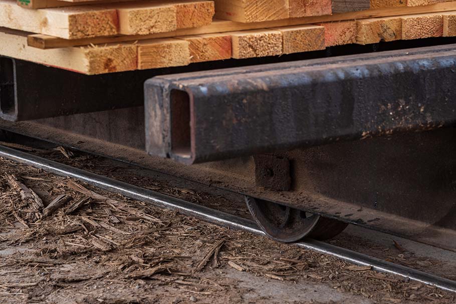 A close up of the underside of a kiln cart loaded with lumber