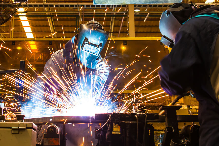 Workers weld prototype automotive fabrications