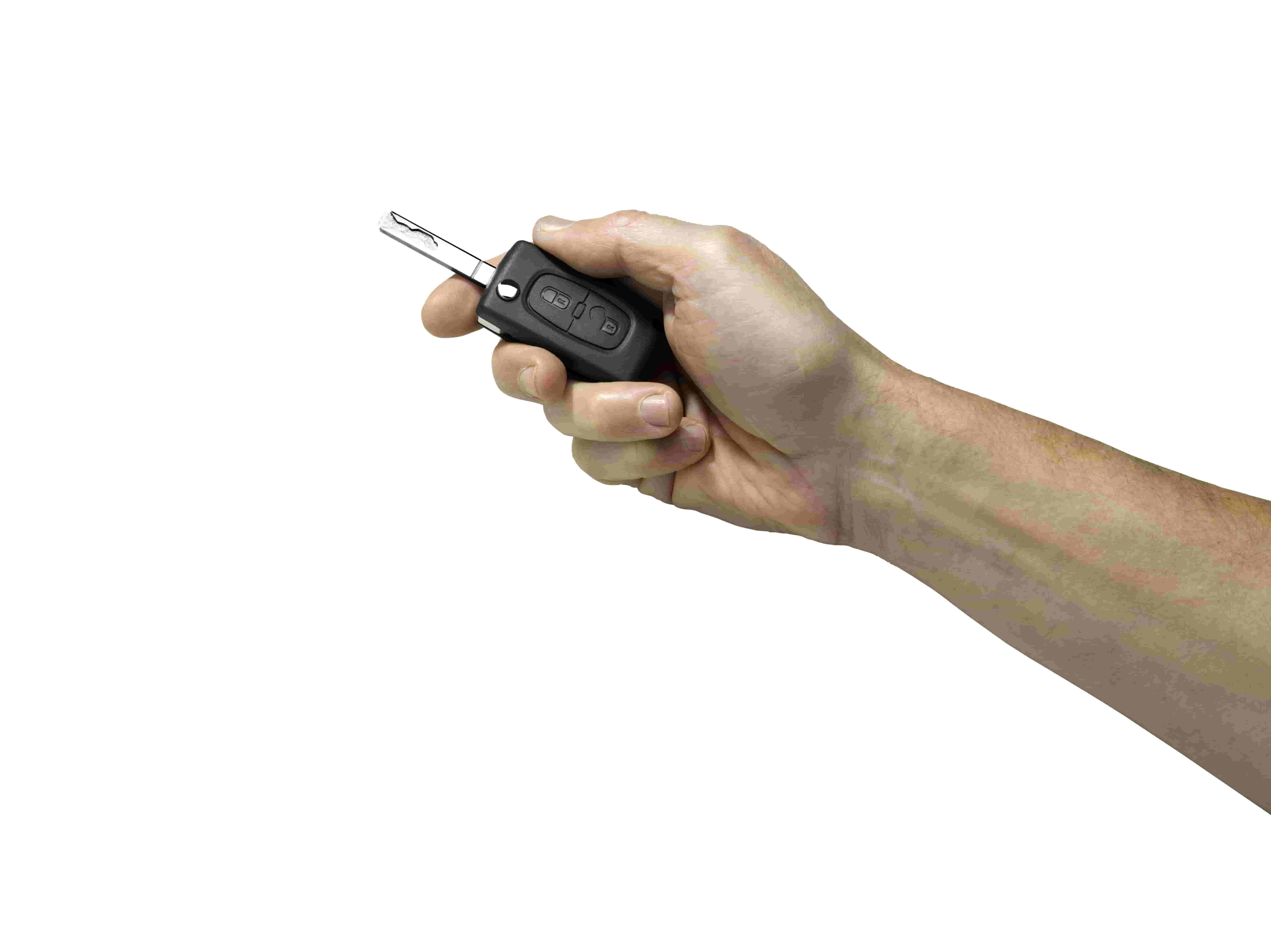 hand holding car key on white background