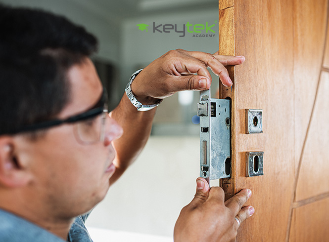 man fitting mortice lock to a door